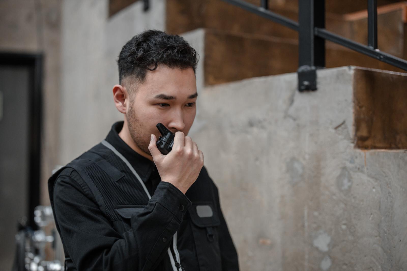 Man using a walkie talkie during an emergency situation