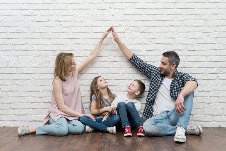 family celebrating their new child-friendly home