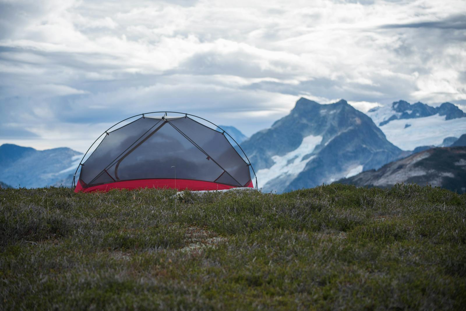 A group of people staying warm in their tent during the cold